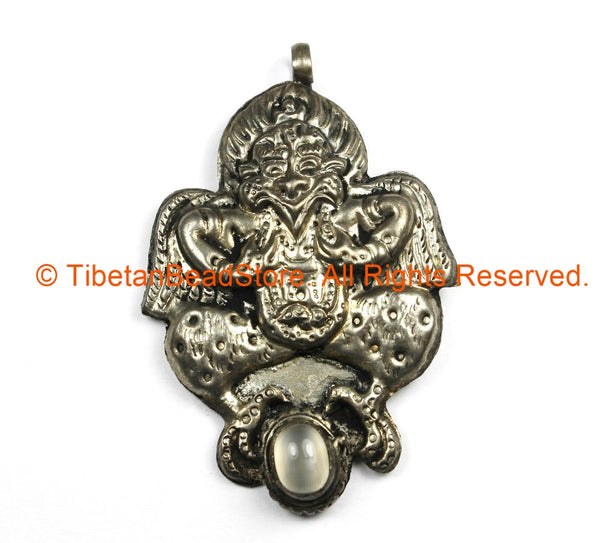 Ethnic Tribal Nepal Antique Look Repousse Tibetan Silver Garuda Pendant with Moonstone Inlay - TibetanBeadStore Handmade Jewelry - WM7211