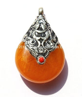 Reversible Tibetan Amber Resin Pendant with Tibetan Silver Caps, Repousse Auspicious Conch & Double Fish Details - WM2833