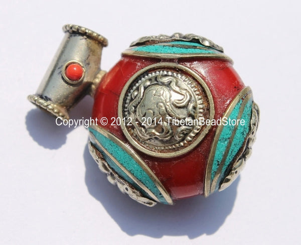 Tibetan Reversible Round Red Copal Resin Pendant with Turquoise Inlays, Tibetan Silver Repousse Auspicious Conch & Vajra Details - WM4110